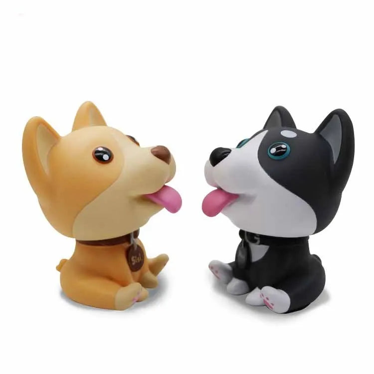 PVC nodding dog bobblehead in khaki, 9.3 cm tall, on a car dashboard