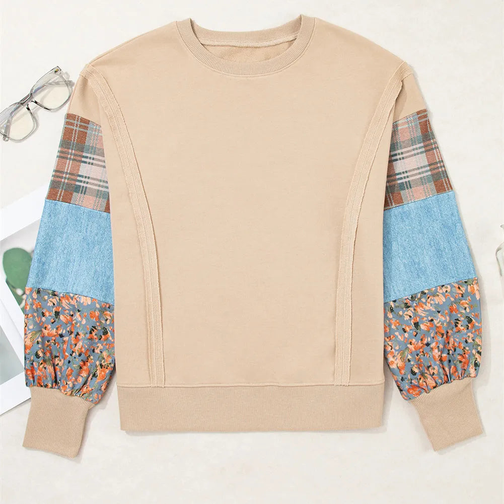 Women's loose fit apricot plaid stitch long sleeve pullover top on hanger.