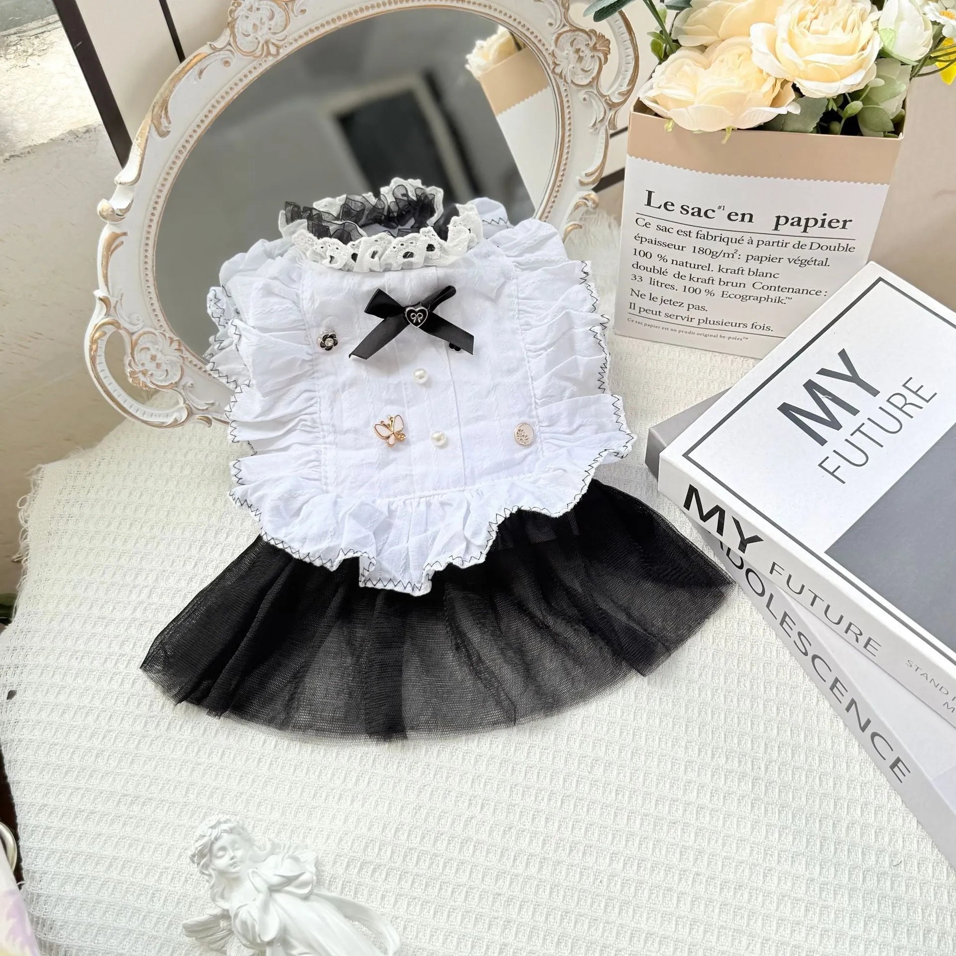 White polyester gauze skirt for a small dog, showing princess style and tiered design on a mannequin.
