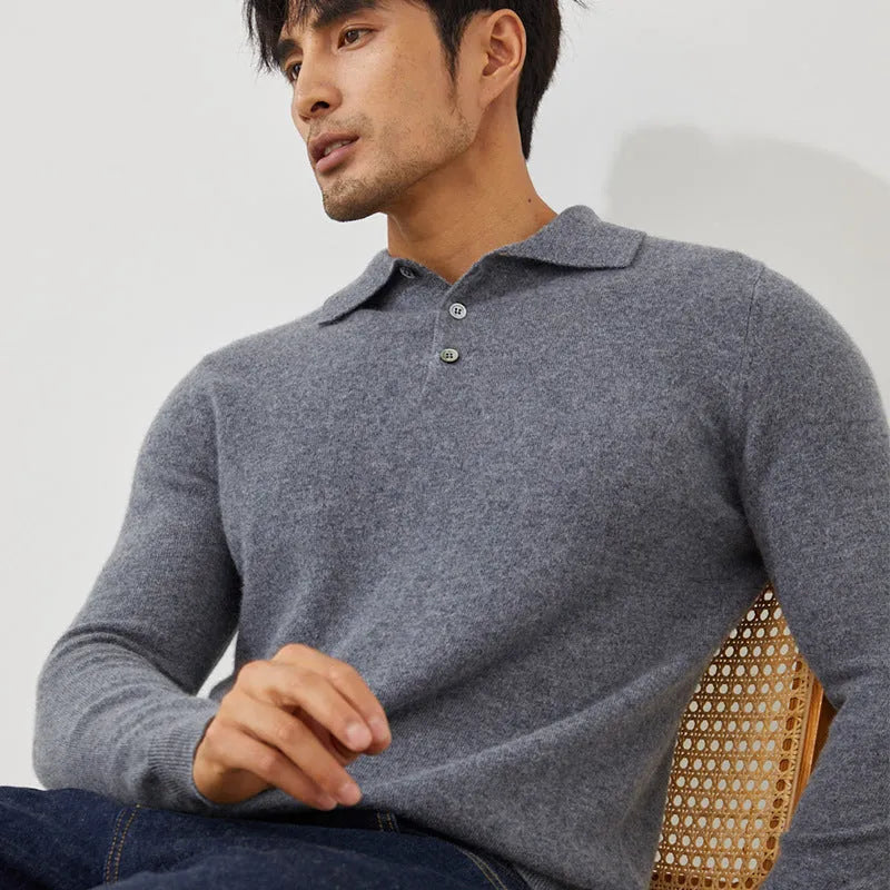 Man wearing a sapphire blue loose-fit cashmere pullover sweater with a polo collar.