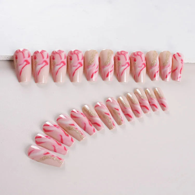 Wearable manicure set showing 24 false nails in various patterns with glue bottle