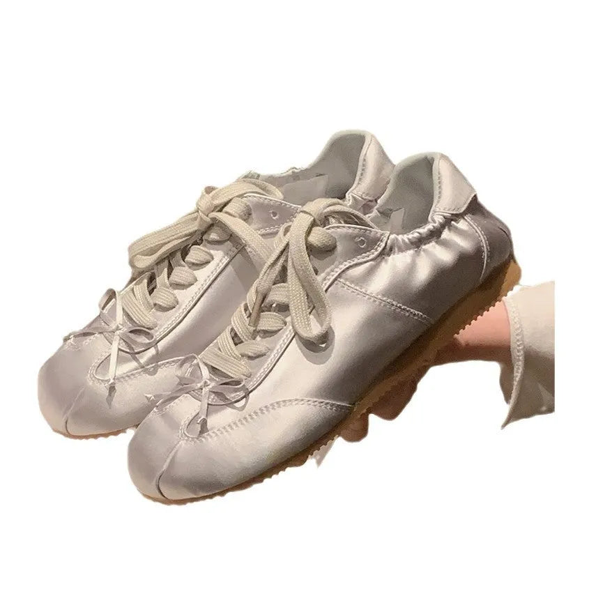 Women's silver grey satin ballet style sports board shoes with round toe and front lace-up design