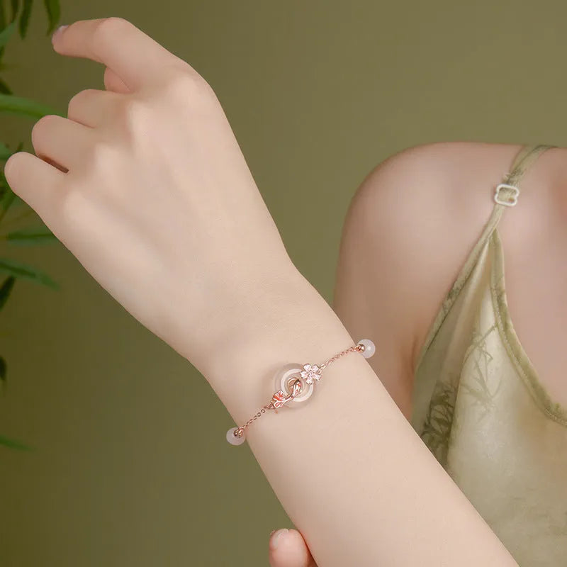 S925 sterling silver bracelet with white chalcedony crystals on a wrist