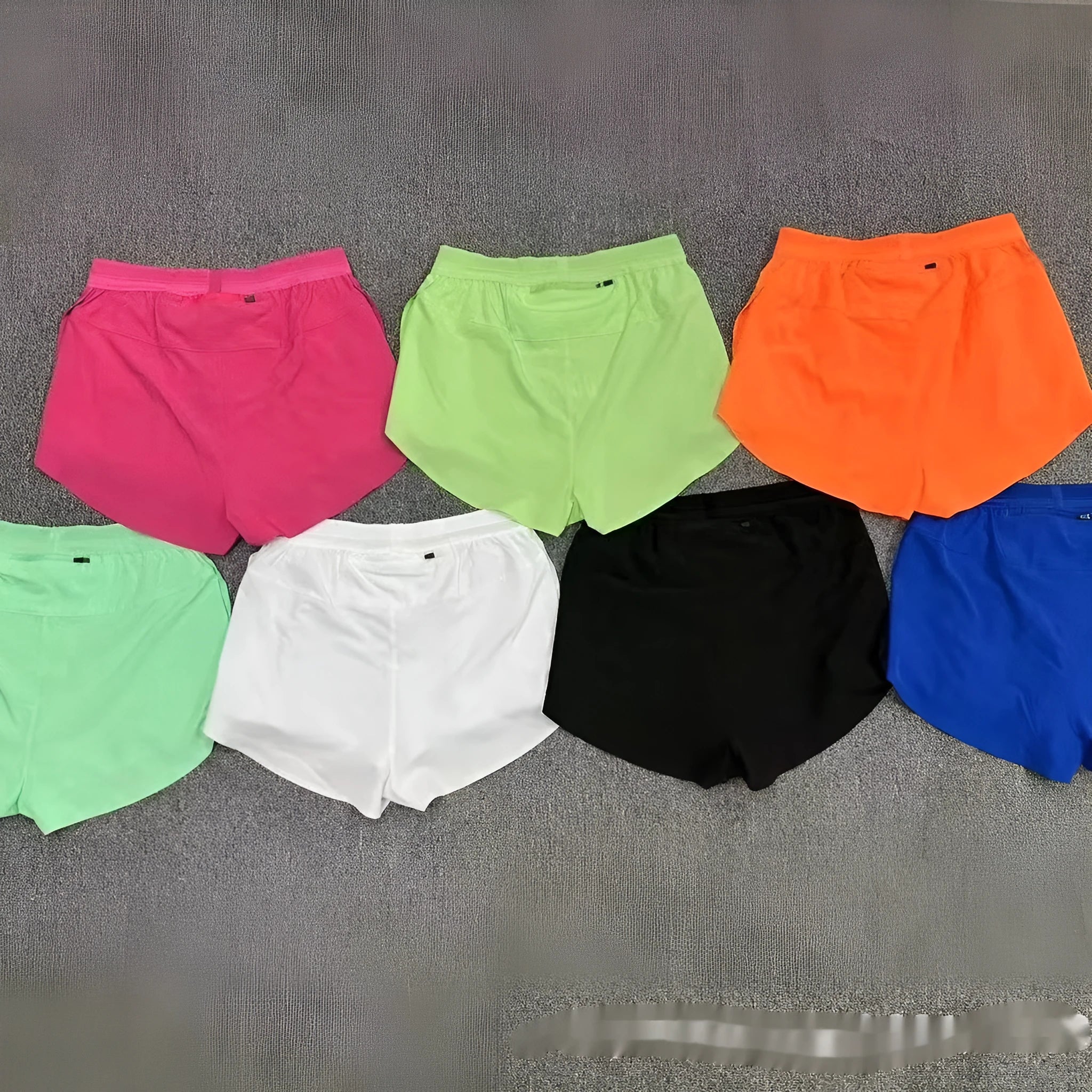 Pocket marathon running shorts with breathable lining in orange colour, front view