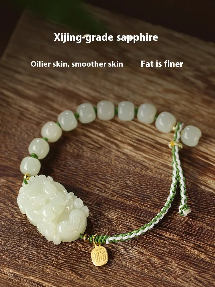 Hetian jade zodiac bracelet on red rope with S925 silver card for Chinese birth year animals.