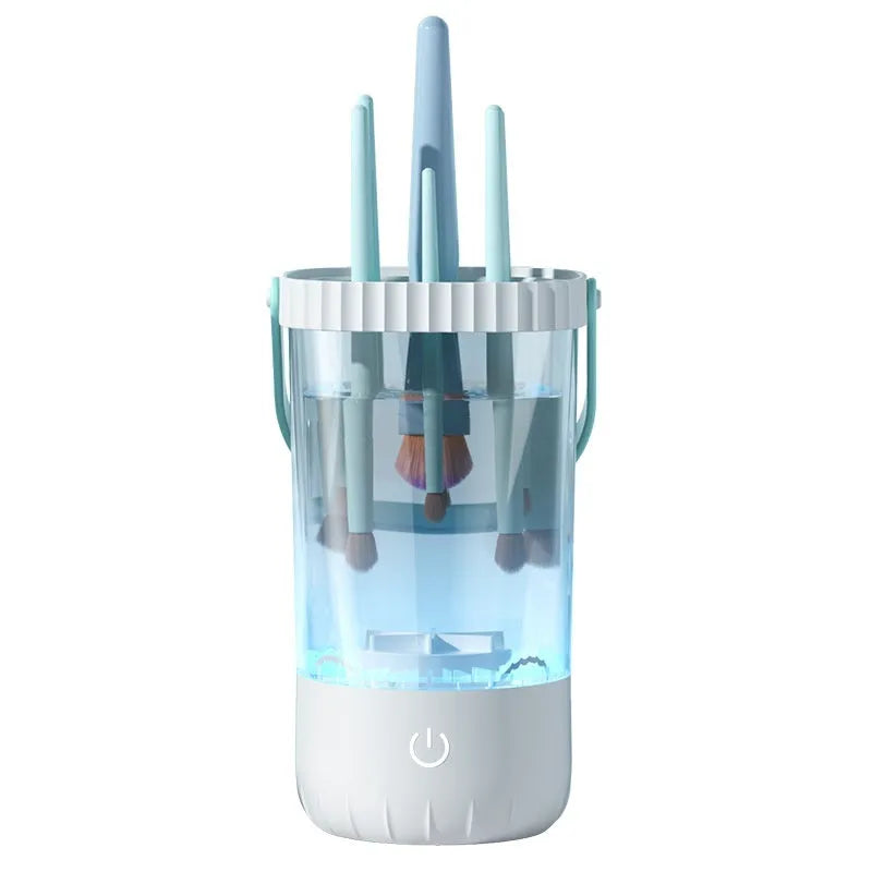 White rechargeable electric makeup brush cleaning device with USB cable.