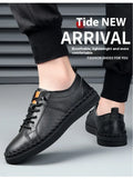 Men's beige and black cowhide leather sneakers with round toe and visible stitching on a white background.
