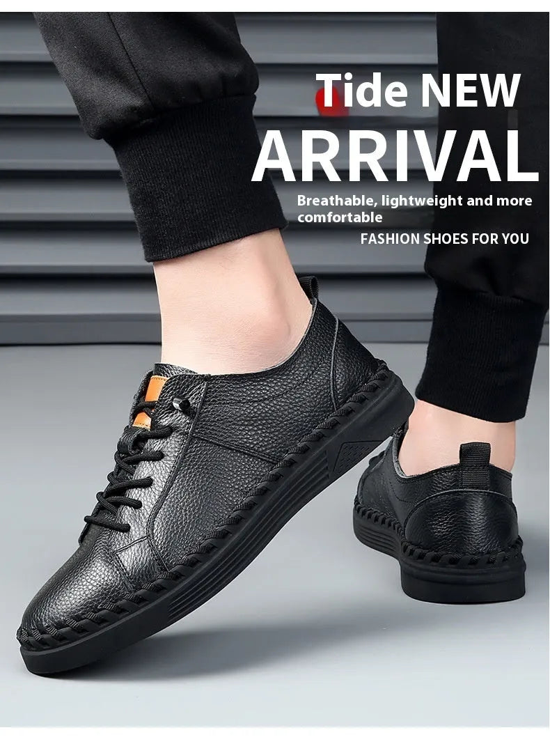Men's beige and black cowhide leather sneakers with round toe and visible stitching on a white background.