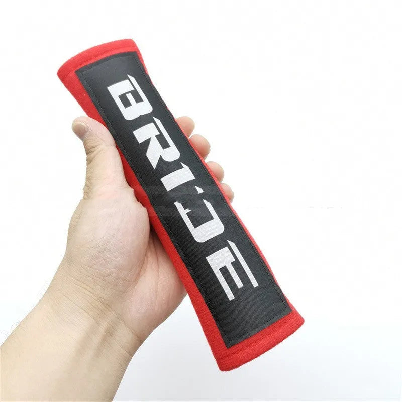 Car safety belt shoulder pad set in black, blue, or red colours, made from cotton sponge cloth.