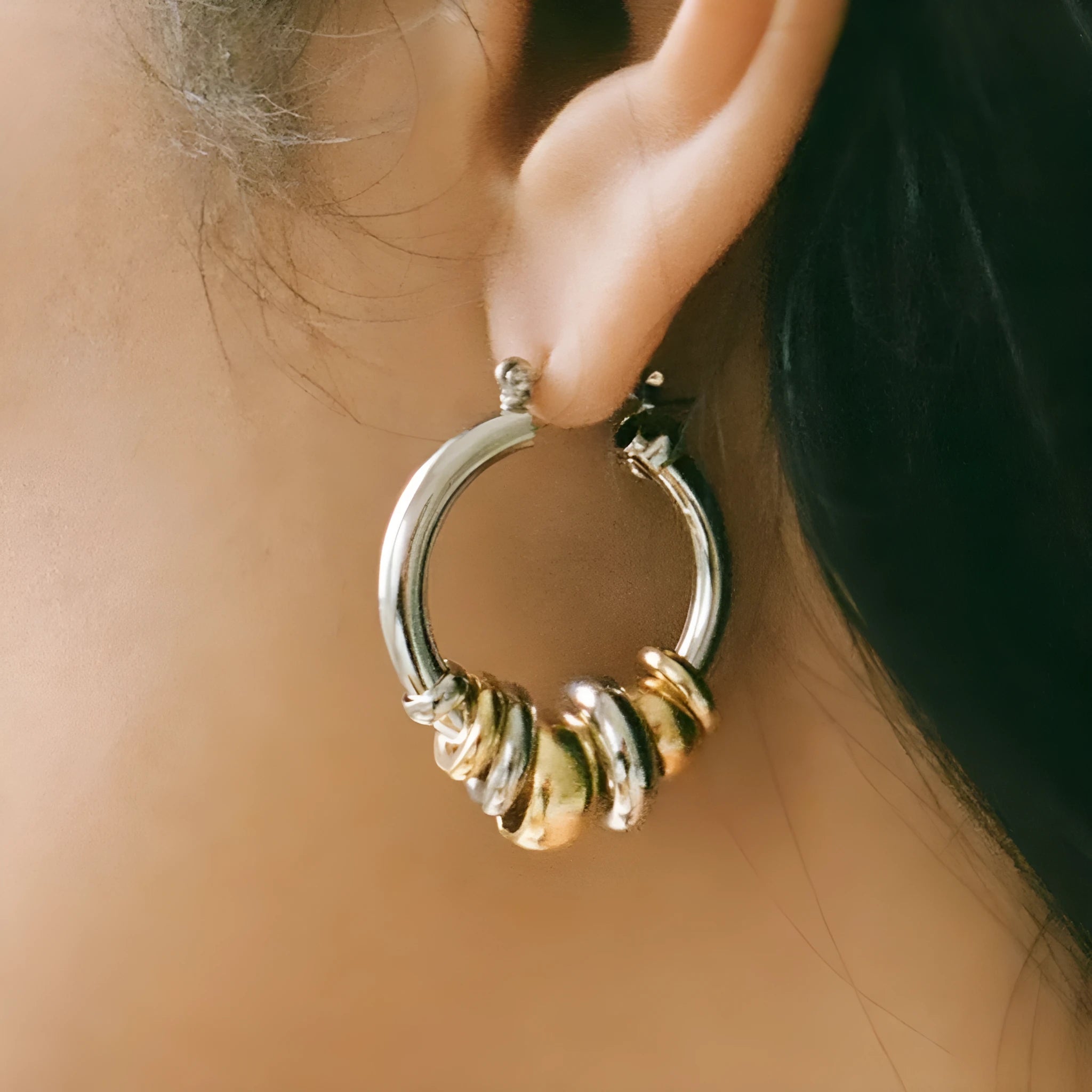 Women's stainless steel colour matching earrings in geometric ring style with electroplated gold finish