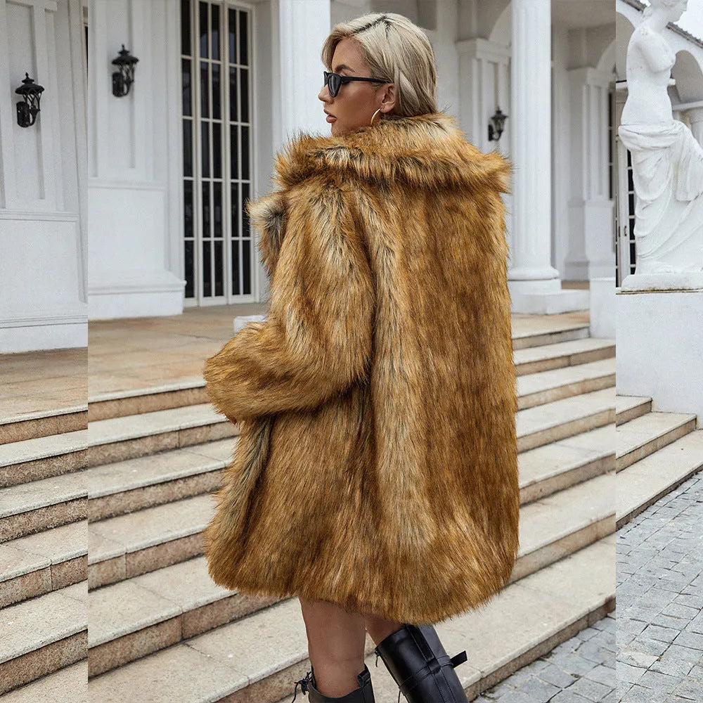 Yellow loose-fit women's faux fur coat on a hanger, showing mid-length design and plush texture.
