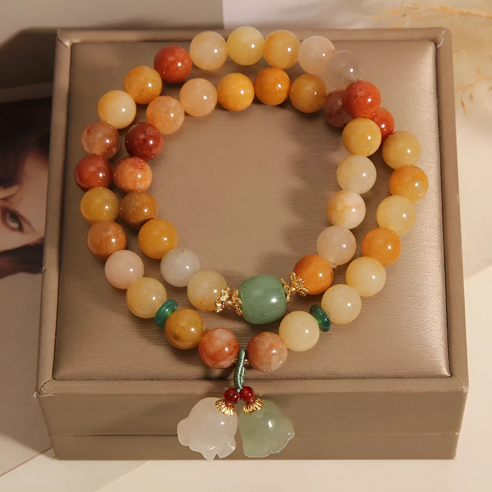 Natural Jinsi Jade multi-layer women's bracelet with adjustable cord tie closure and orchid pendant