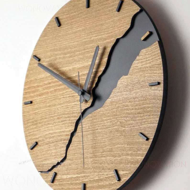 Modern wooden wall clock with a creative crack style design on its face.