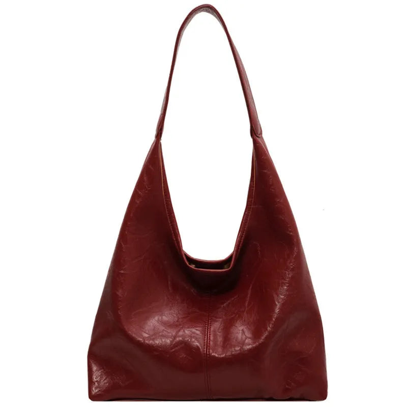 Soft PU leather large capacity shoulder bag in multiple colours with front sandwich pocket.