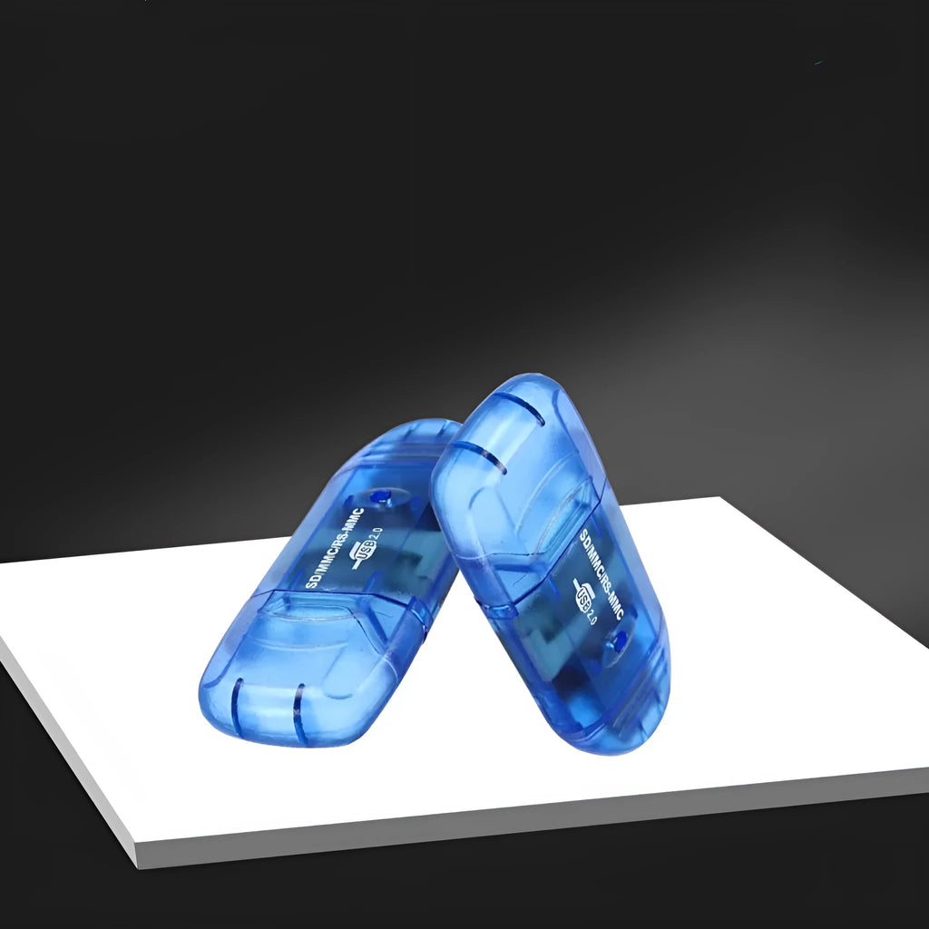 Transparent plastic USB card reader with LED light option on a desk next to memory cards.