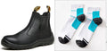 Black high-top leather safety work boots with steel toecap on a grey background.