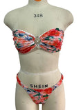 Women's polyester bikini set with floral print tube top and matching briefs for swimming.