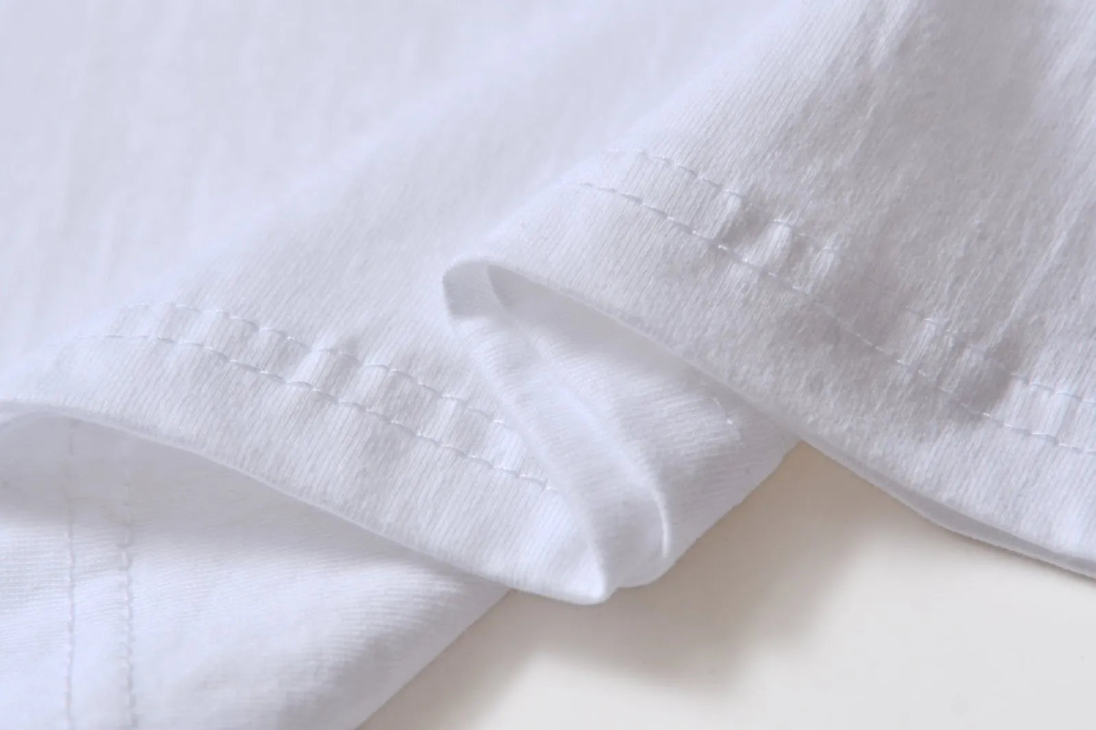 White cotton t-shirt overalls with round neck and short sleeves in loose fit
