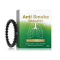 Men's glass and black gallstone smoke prevention bracelet on a wrist.