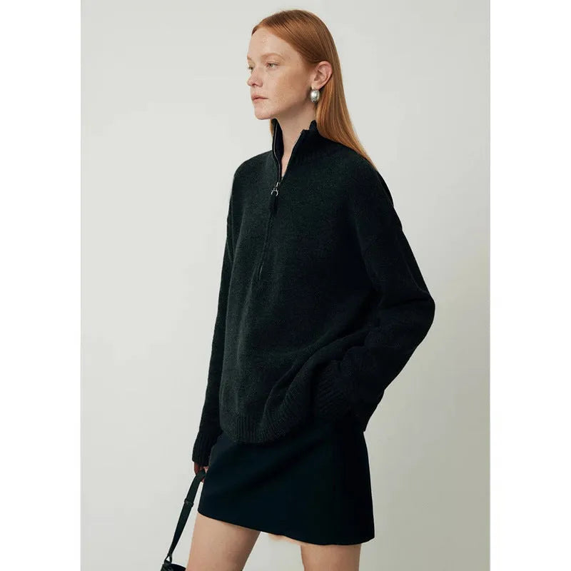 Wool bandage dress with loose lapel neckline and long sleeves in black.