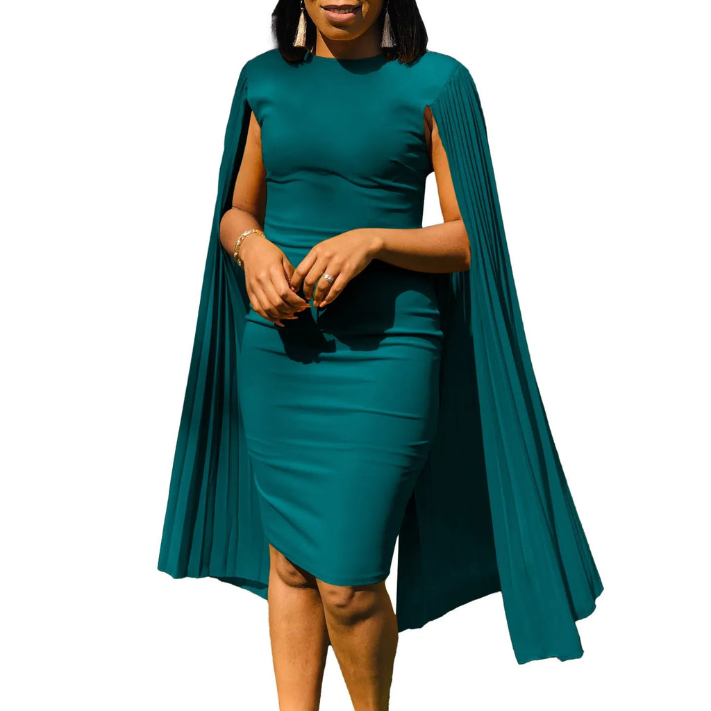 Yellow long sleeve evening gown with high waist and pleated skirt, model facing forward.