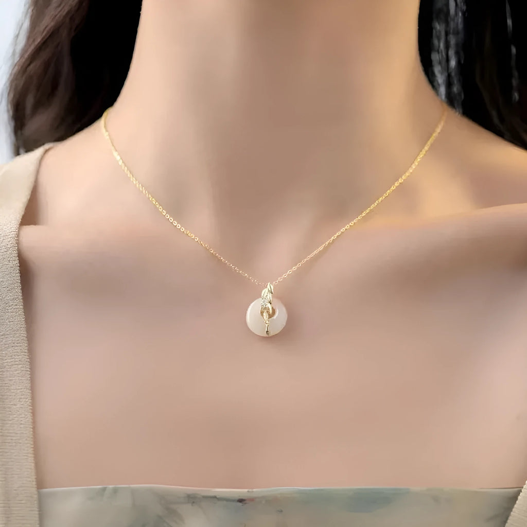 Chinese style wheat necklace with 925 silver chain and jade-inlaid pendant on white background
