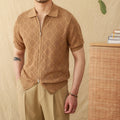 Light brown cotton short sleeve cardigan with a front zipper and lapel collar on a hanger.