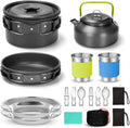 Camping cooker set with hard aluminium boiling pan, frying pan, teapot, stainless steel cutlery, cups, and plates on outdoor table