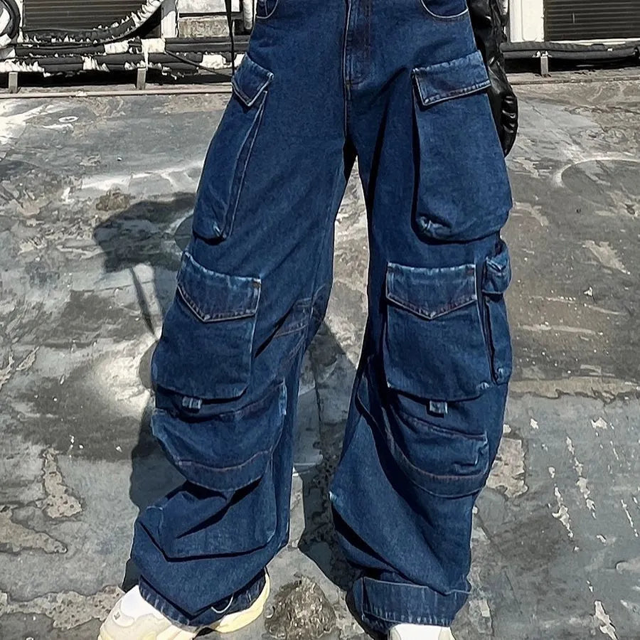 Dark blue distressed wide-leg jeans with a high waist and multiple pockets on a hanger