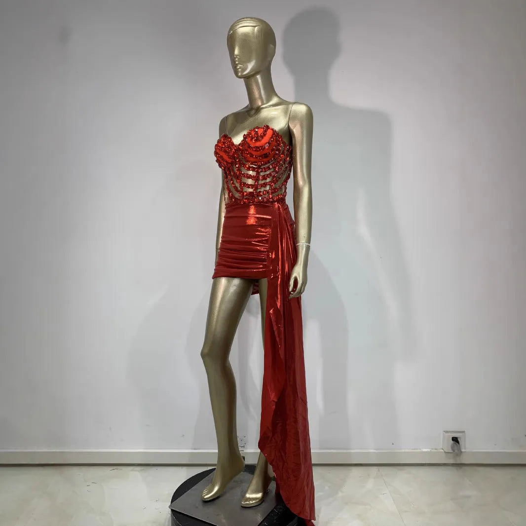 Red two-piece stage costume with hollow mesh panels and a skirt, made from stretch spandex for performers.