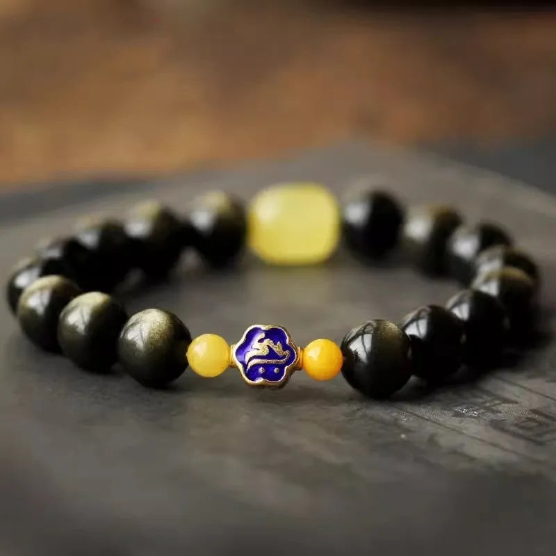 Golden obsidian ethnic bracelet with zodiac symbols on geometric 10mm stones