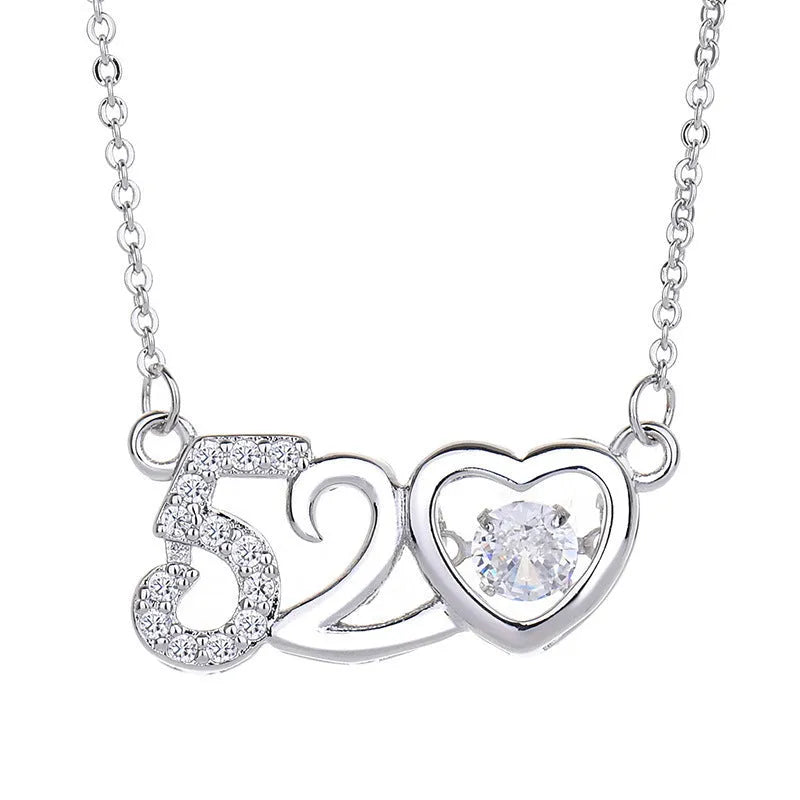 Women's silver heart-shaped necklace pendant featuring a crown and bow design on an adjustable chain.