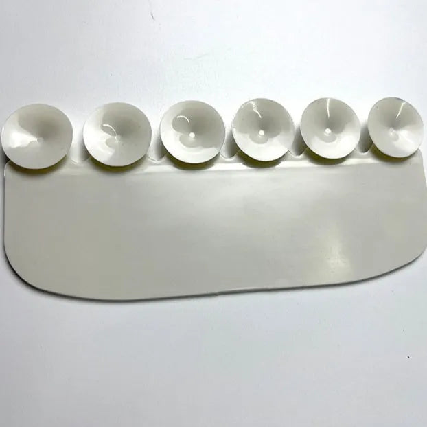 White PVC urine blocking board placed on toilet seat for children's splash prevention