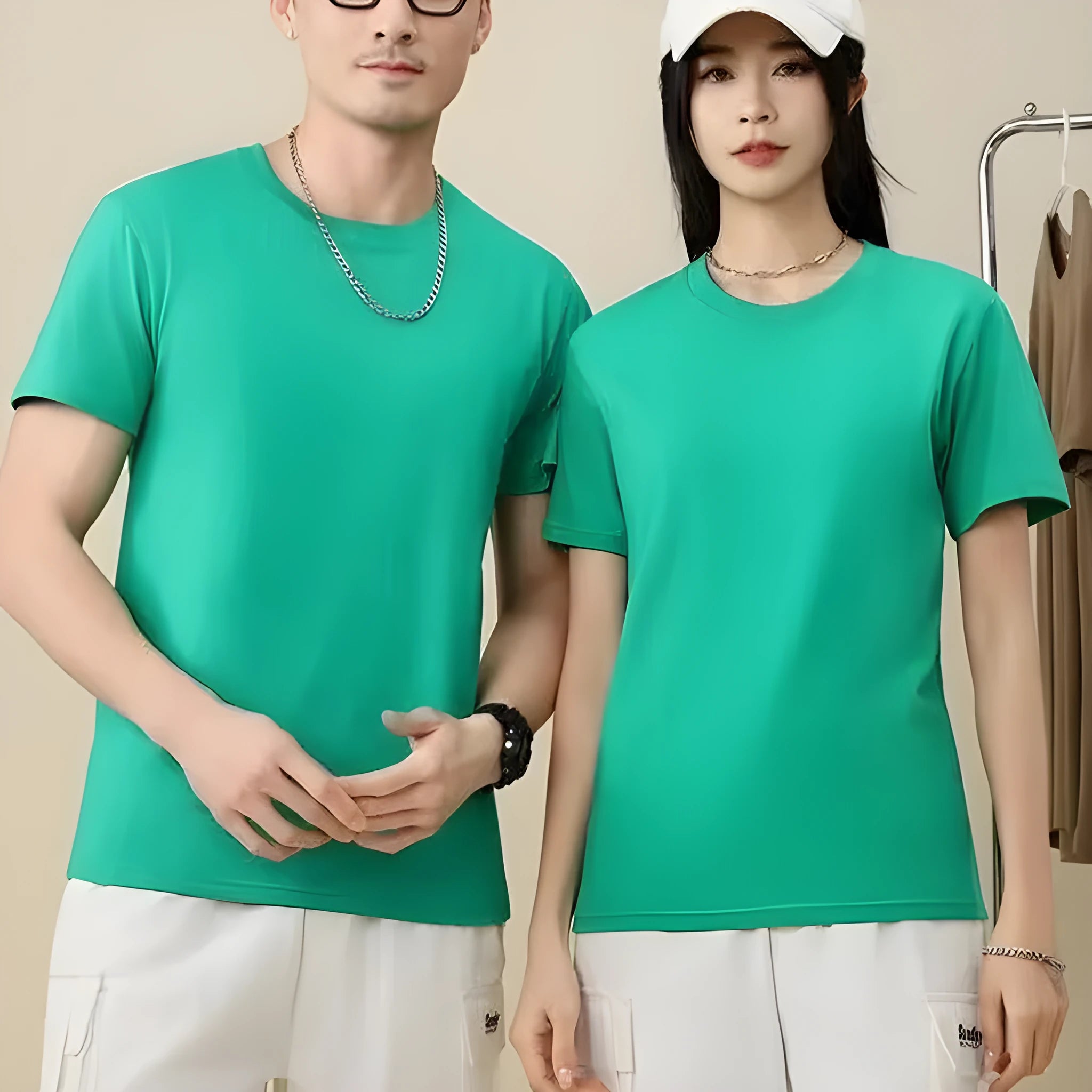 Unisex loose fit cotton t-shirt shown in multiple solid colours including navy blue, red, and white