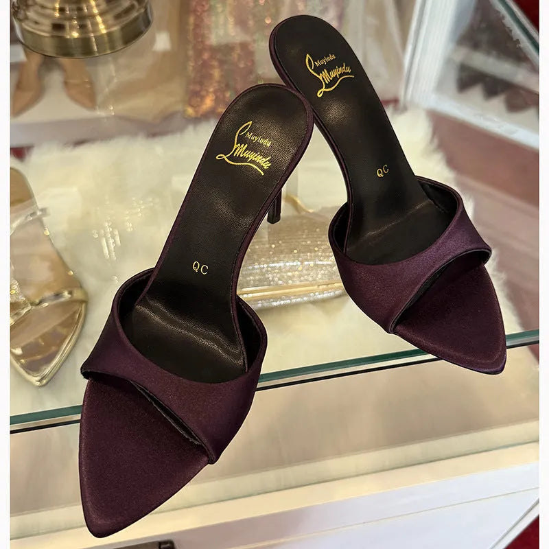 Women's black patent leather stiletto sandals with pointed toe and a high heel