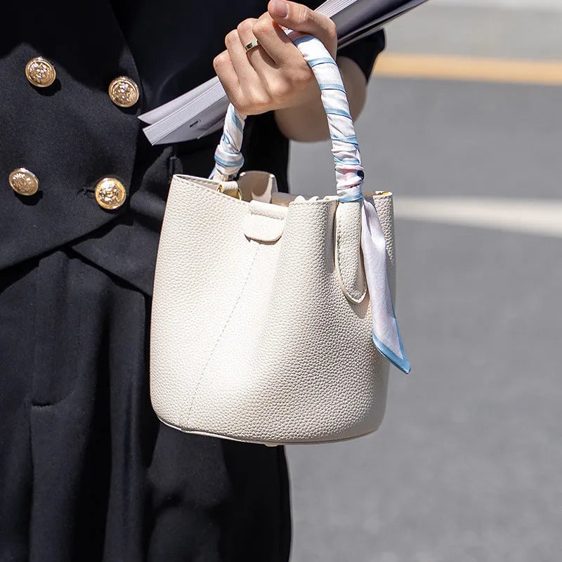 Simple fashion PU handbag for women with bow detail in milky white colour