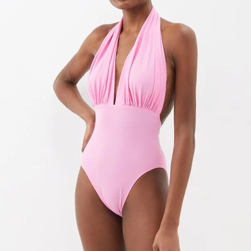 Women's backless one-piece swimsuit with deep V halter neckline in solid flower pattern polyester fabric