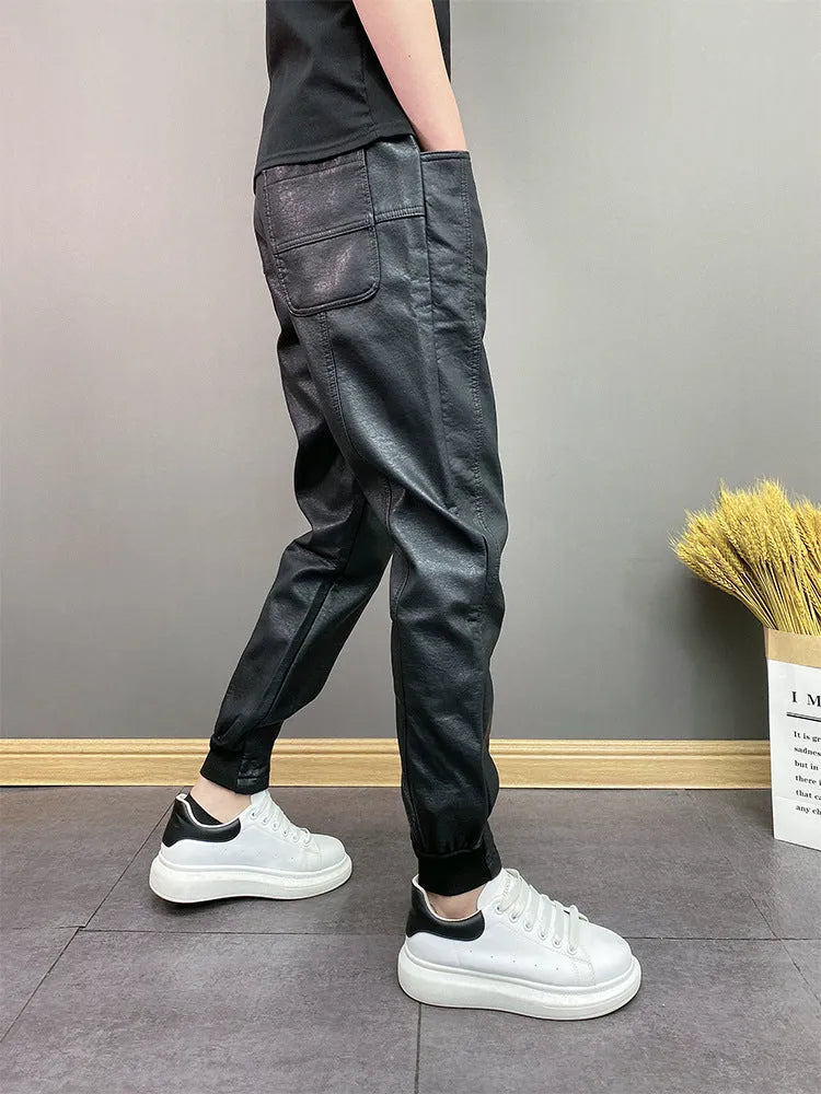 Black waterproof windproof casual rider motorcycle tapered pants with artificial leather lining and mid-rise waist