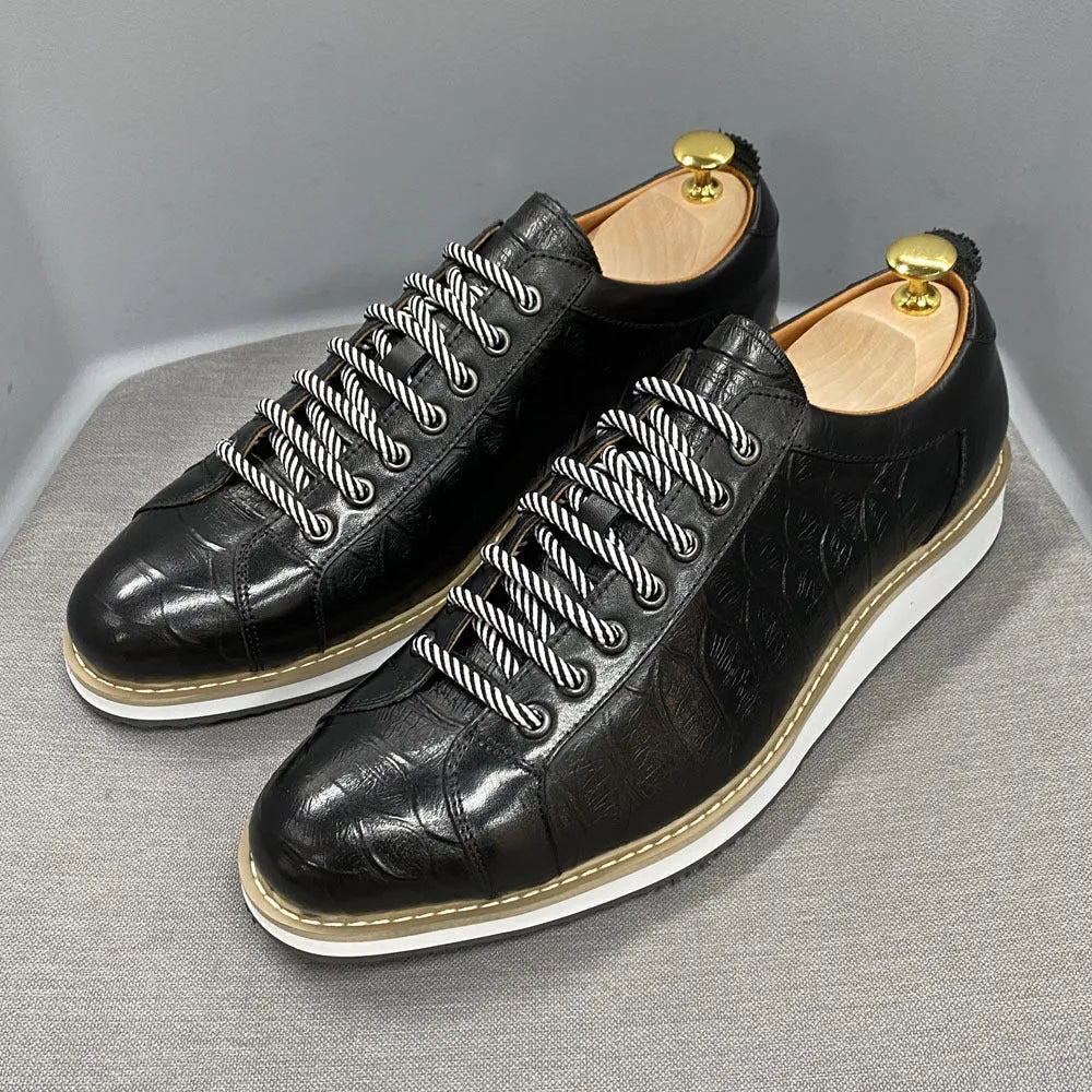 Men's white low-top casual shoes with embossed pattern texture on the front, featuring front tie laces.