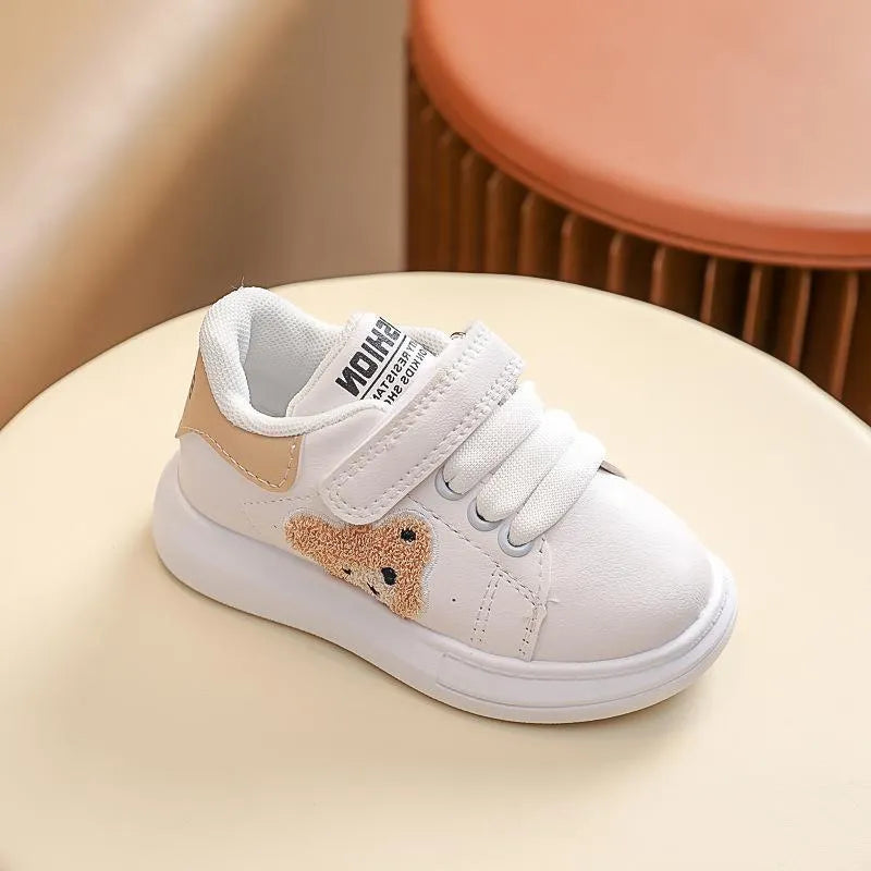 Baby Bear cartoon pattern kids sports sneakers in black, green, and khaki on a white background.