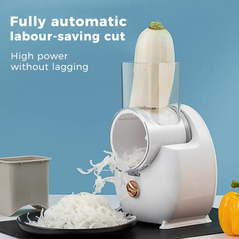 White electric vegetable slicer with suction base, multiple blades, and USB charging cable.