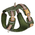 Brown leather dog harness with reflective strips and metal buckle closure