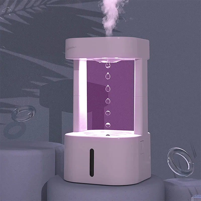White portable humidifier with anti-gravity water droplet illusion and 580ml transparent tank