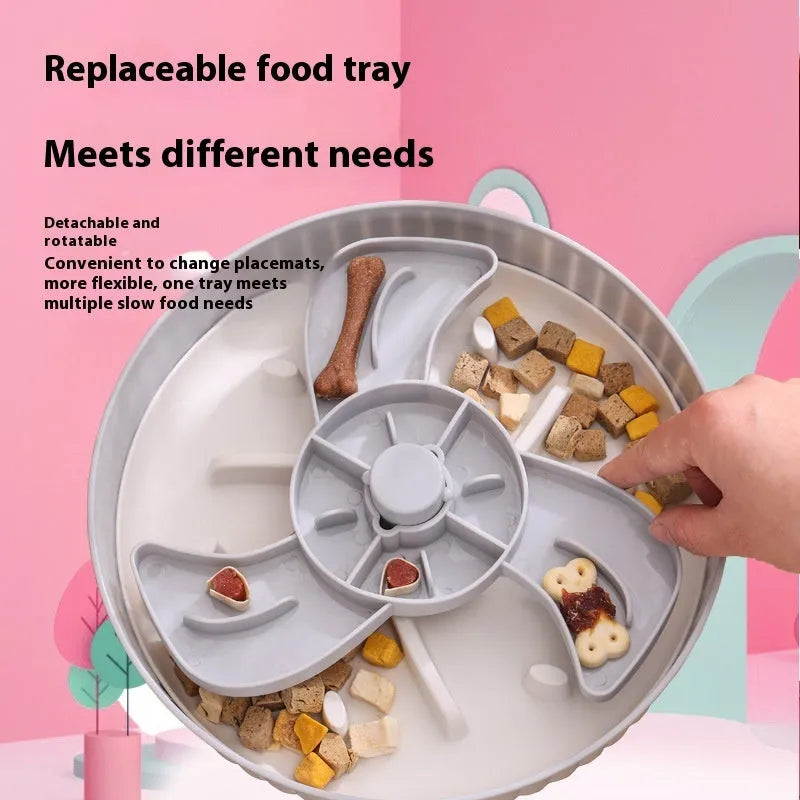 Interactive rotating slow-feed dog bowl with blue silicone licking mat in a windmill pattern.