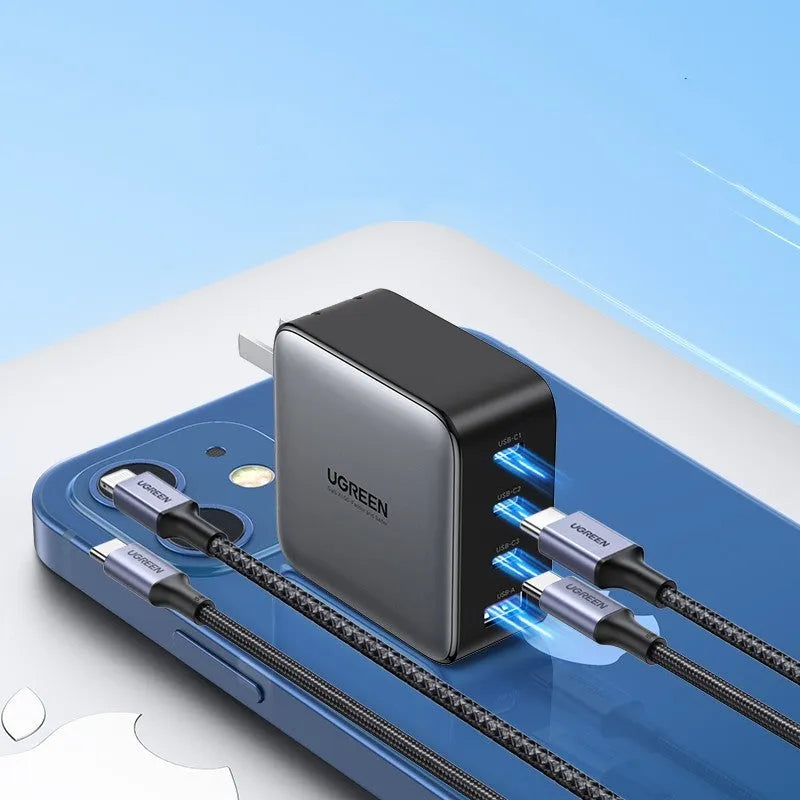 Compact 100W gallium nitride fast charger with Type-C port and included cable on a white background.