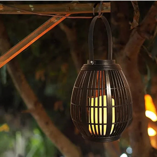 Oval solar garden light with rattan wind lamp design measuring 180x180x230mm