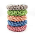 Natural cotton braided ring dog chew toy showing woven knot texture