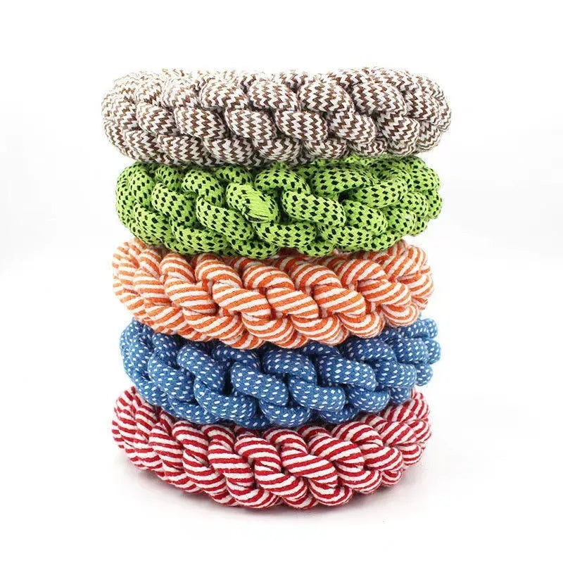 Natural cotton braided ring dog chew toy showing woven knot texture