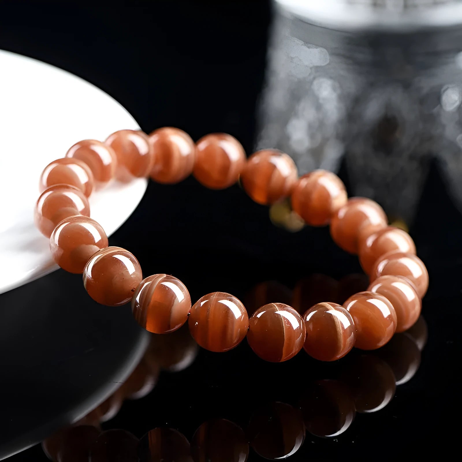Natural old mine rhodochrosite round bead bracelet from Peru with ruyi charms.