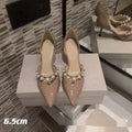 Women's pointed patent leather high heels with stiletto heel and pearl decoration